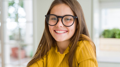 troy teen girl smiling with glasses