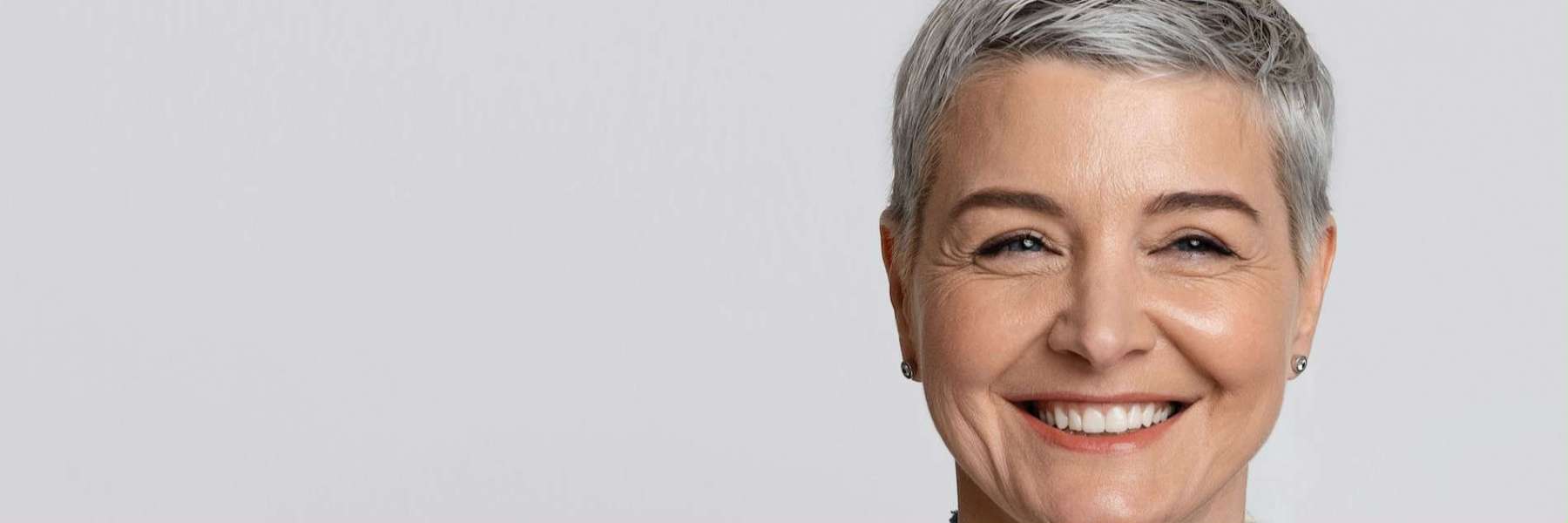 troy woman smiling after getting dental implants