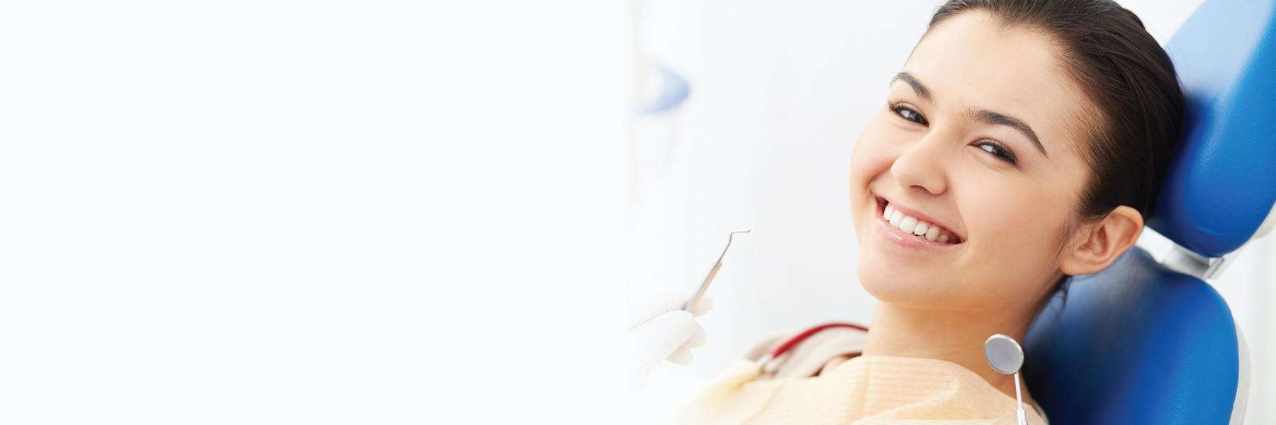 smiling woman sitting in dental chair